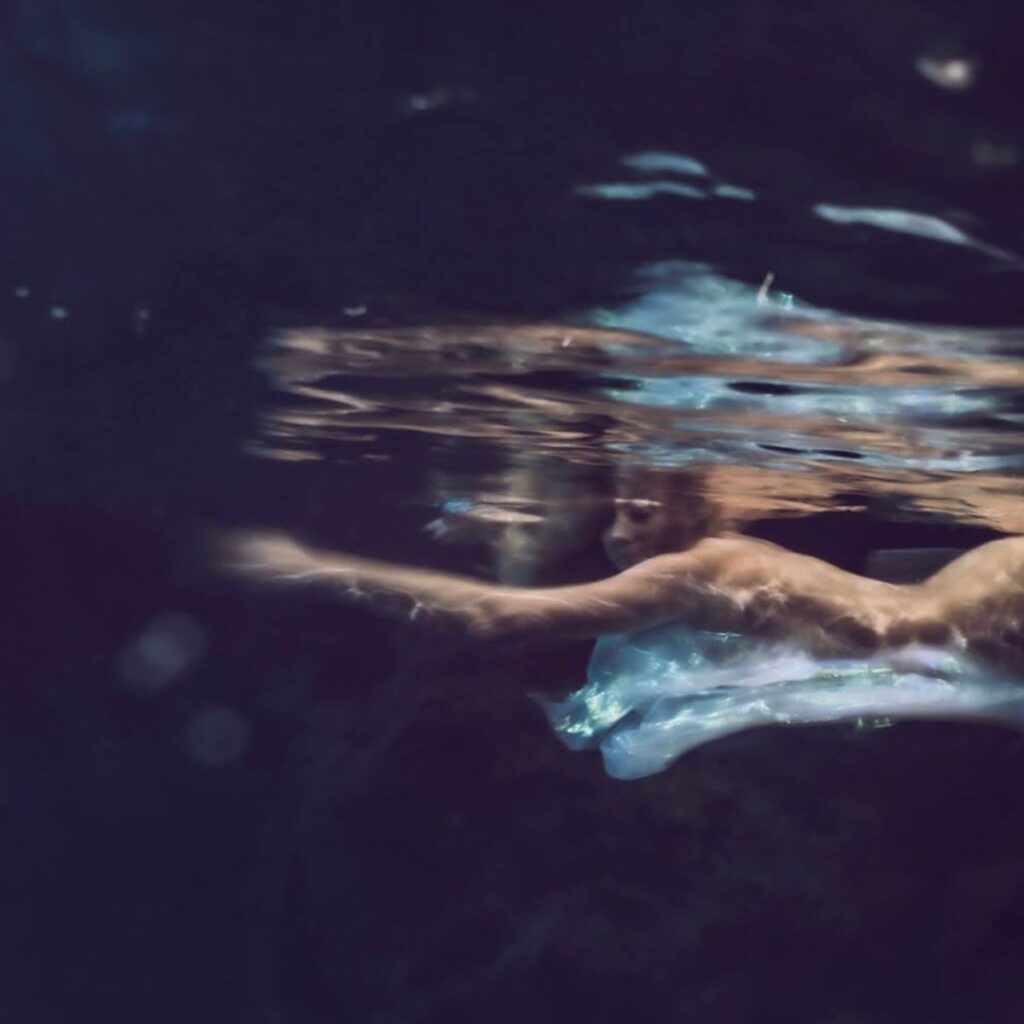 Artistic underwater swimmer representing the immersive multi-hour Spa Oeuvre experience. Photograph by Kelly Hsiao